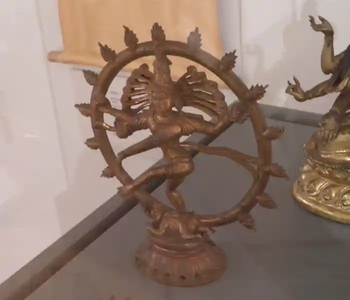 Four-armed dancing shiva inside a circle with flame-like rays